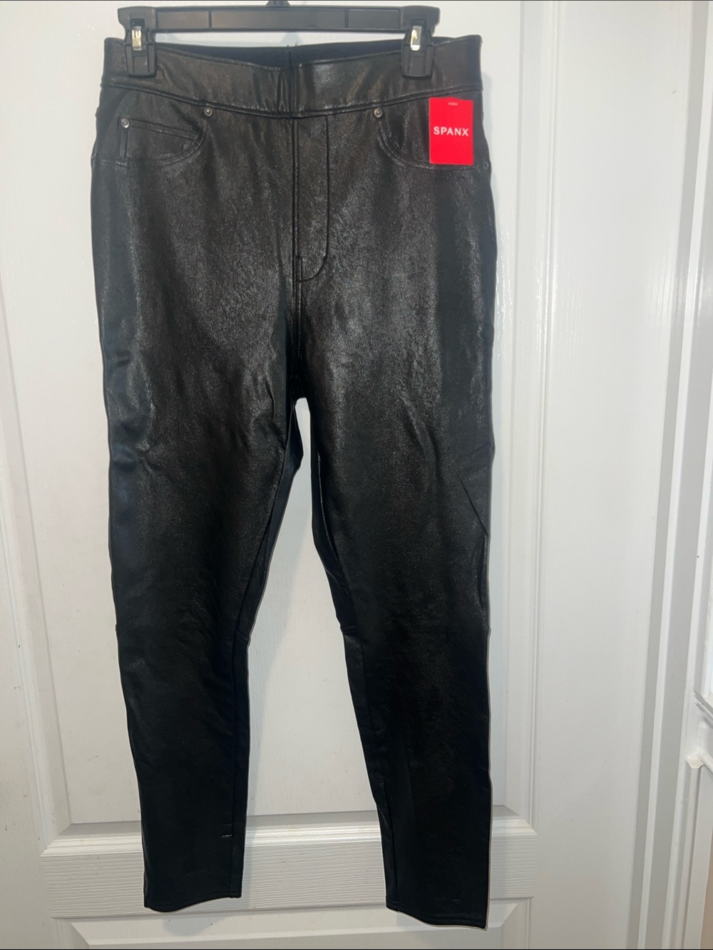 NWT SPANX Women’s Black Faux Leather Slim Cut Jeans. Totally cute! Size Medium.